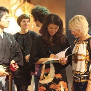 Signing a copy with Hibiki.
